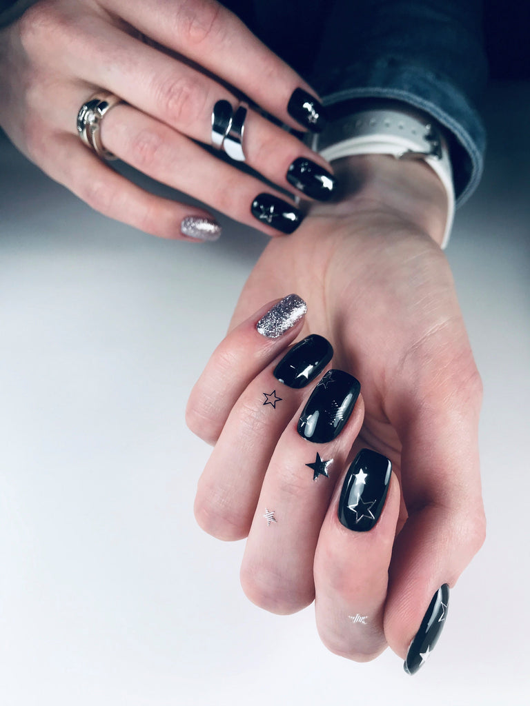 Black nails with silver glitter stars